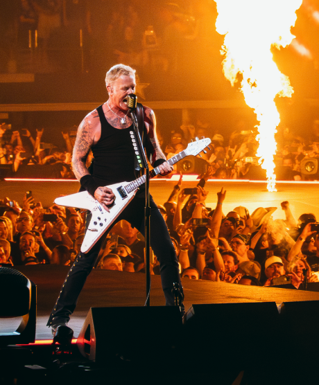 View a photo of James Hetfield of Metallica plays guitar on stage in Arlington, TX in color.