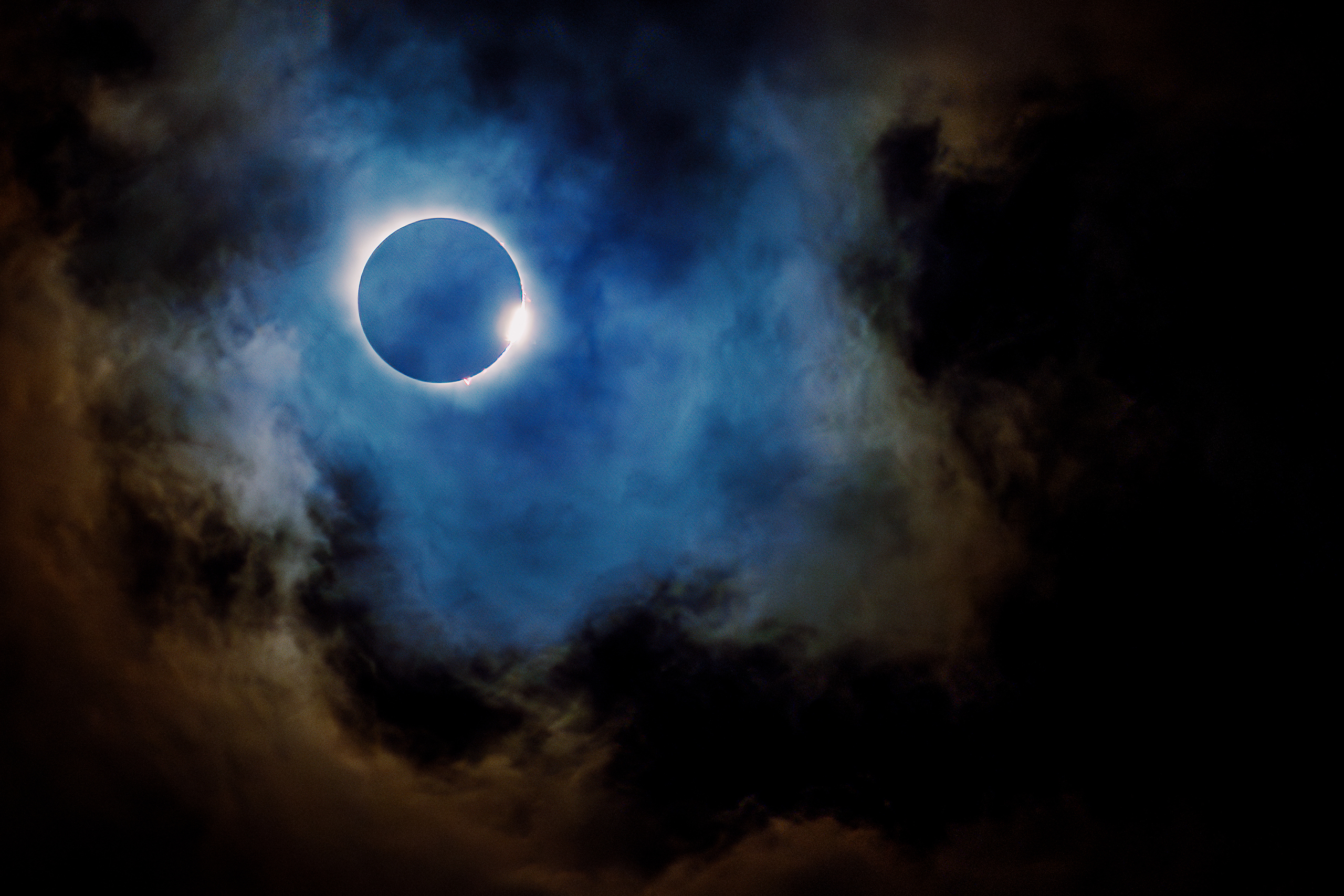 Totality of the solar eclipse seen through the clouds in Dallas, TX.